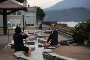 A Japanese couple enjoy foot bath, ashiyu, in Sakurajima, Kagoshima.