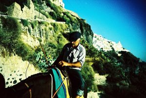 Man on a donkey in Santorini
