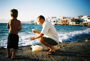 Father and son fishing in Mykonos