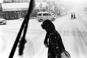 People on a street under the heavy snow in Otaru, Hokkaido.