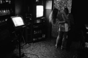 A girl dances with her customer in a Karaoke bar in Tokyo.