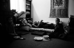 Tibetan Buddhist monks have lunch in their room in Shechen Monastery in Kathmandu, Nepal