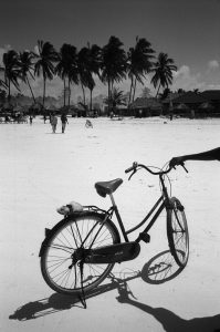 A man with his bicycle on the beach in Paje, Zanzibar, Tanzania.