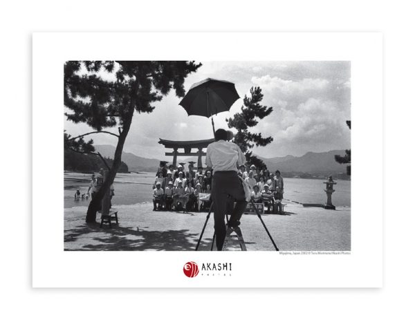 A photographer takes a group picture in Miyajima