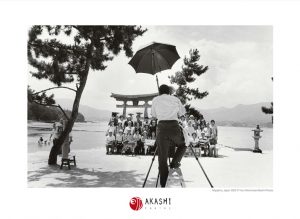 A photographer takes a group picture in Miyajima