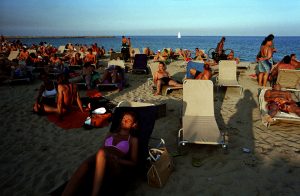 Tourists on the Barceloneta beach in Barcelona, Spain.